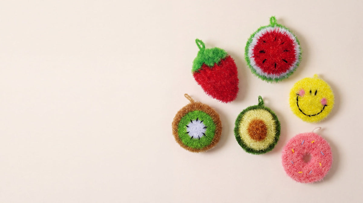 All six frubbies kitchen scrubbers laid out on a cream background