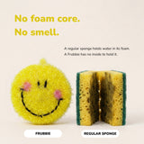 The smiley scrubber beside a cut-open kitchen sponge, showing it has no foam core