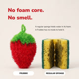 The strawberry scrubber beside a cut-open kitchen sponge, showing it has no foam core