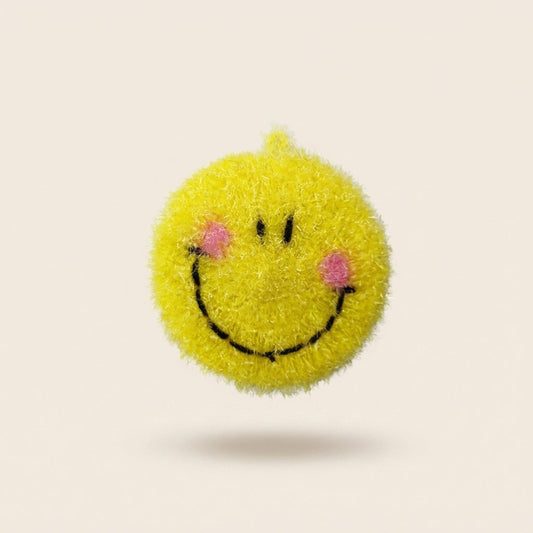 Smiley kitchen scrubber, a round yellow face with pink cheeks
