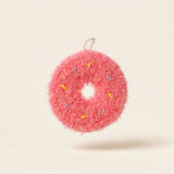 Sprinkles donut-shaped kitchen scrubber in pink yarn with coloured sprinkles