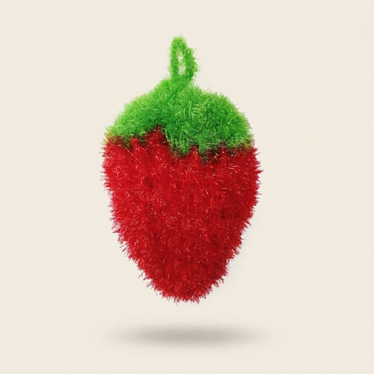 Strawbie strawberry-shaped kitchen scrubber in red glitter yarn with a green crocheted top